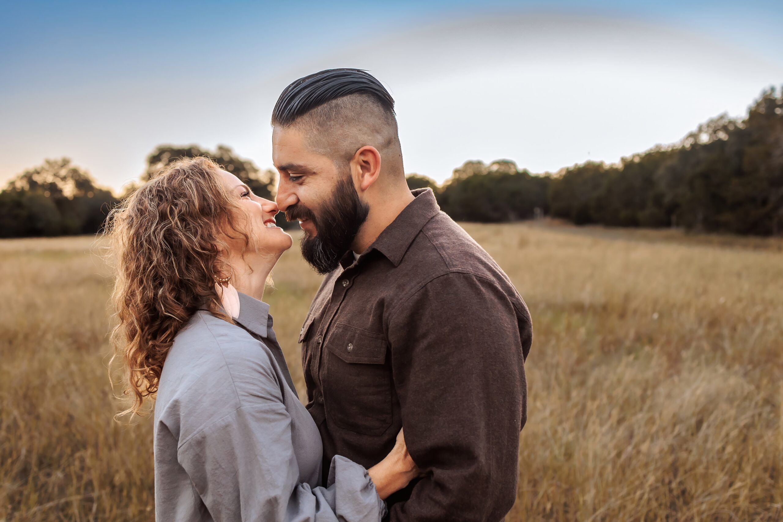 man and woman smiling and almost kissing couples photography boerne tx